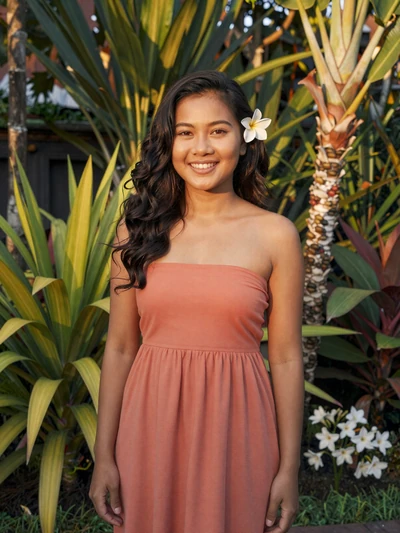 Dewi, 27, Indonesian Balinese woman in coral dress in a tropical garden - Indonesian dating profile